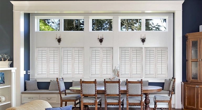 Seattle great room with white plantation shutters.